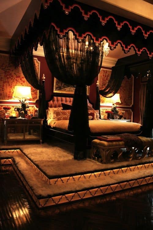 #17 decorate a canopy bed with black chic lace curtains under a black bed frame with red lined edges