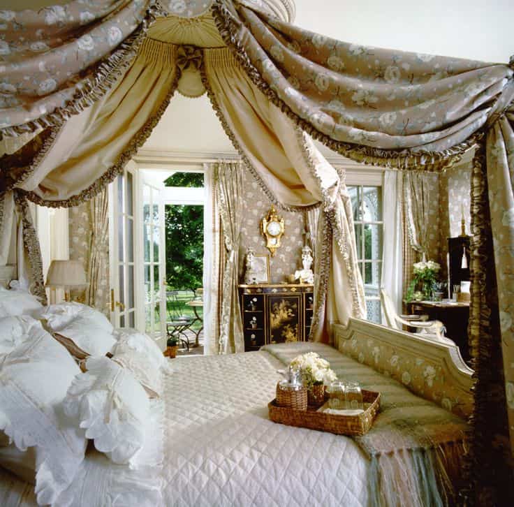 #5 envision a guest bedroom with heavy yellow and gold drapes encircling a full sized bed