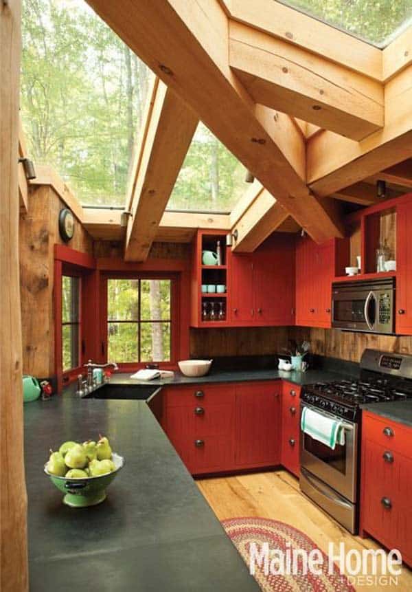 MASSIVE WOODEN BEAMS SHELTERING A KITCHEN WITH A GLASS ROOF
