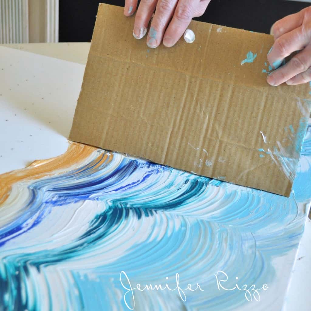 23. MIX PAINT TONES USING A PIECE OF CARDBOARD AND CREATE A WAVE EFFECT