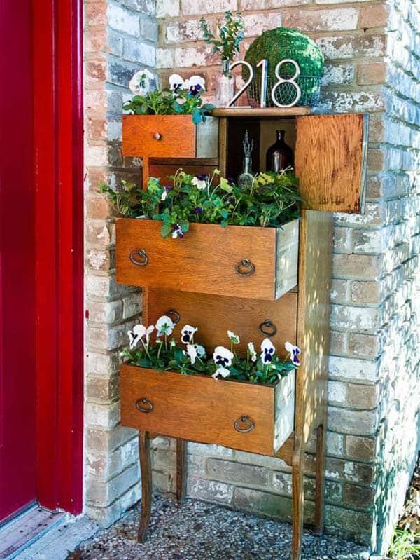 #2 use an old dresser on your porch to adorn greenery