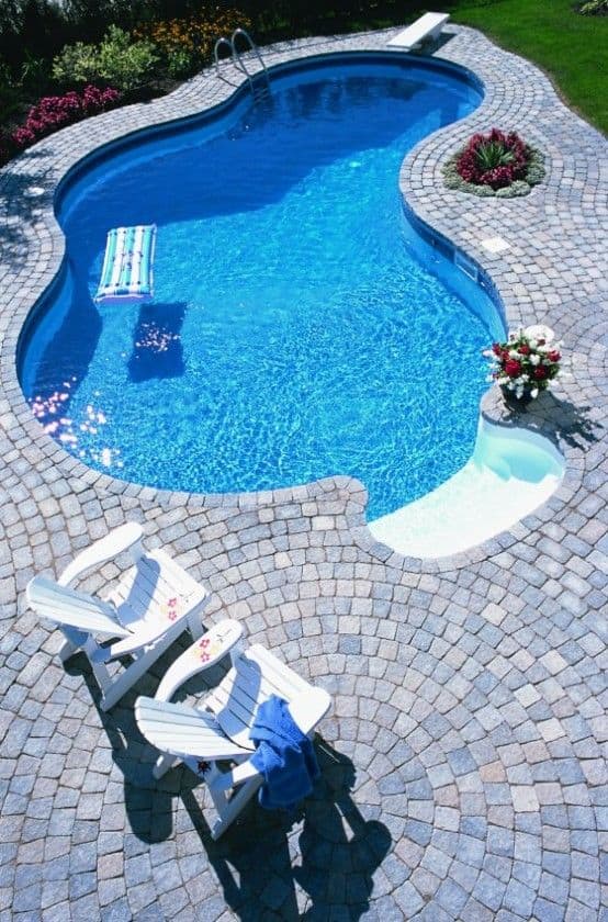 #6 Construct a beautiful swimming area to fit the size of a backyard concreted with clay blocks