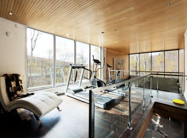 home gym with wooden ceiling and floors and expansive views