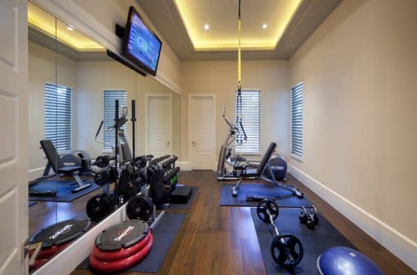 A narrow space can be doubled by a mirror wall, trick often used in home gyms.