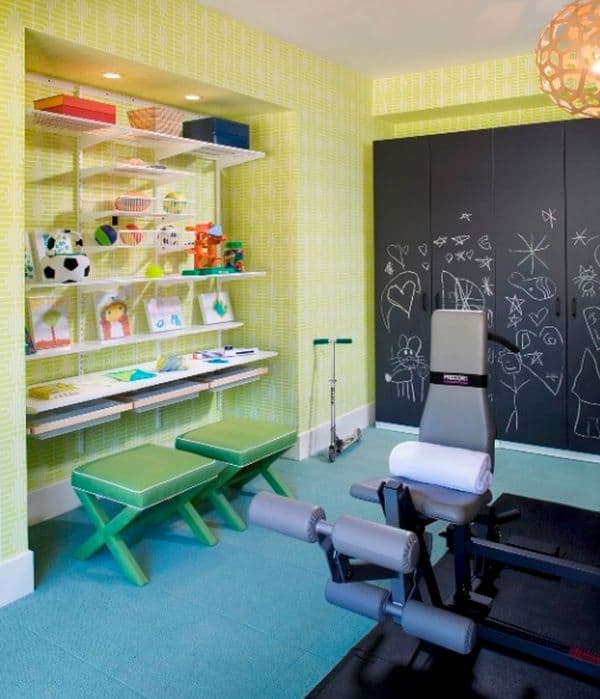Colorful crafting desk for children and and chalkboard storage around a home gym.