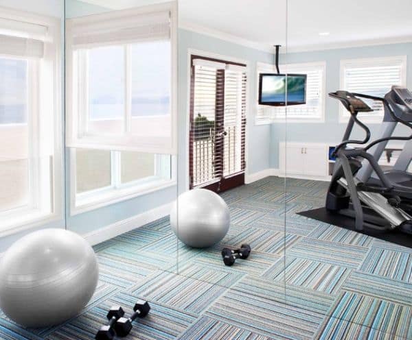 Orientate your gym equipment towards interesting views and dim the decor of the space down to maintain proper focus.