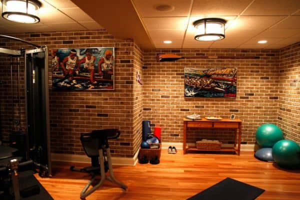 Exposed brick walls and colorful gym equipment can construct a great scenery.