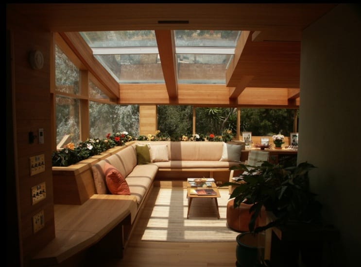 basement living area with peripheral glass and skylight