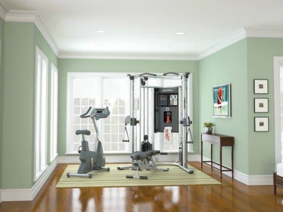 Simple green mint space sheltering a home gym. Find space for yours today.