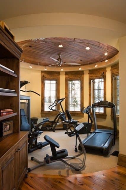Rustic decor home gym with beautiful expansive views. Breathtaking.