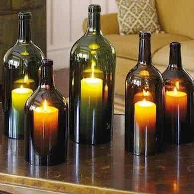 Hurricane candles with empty wine bottles