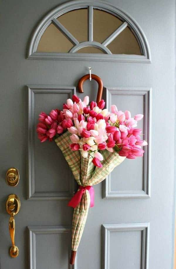 #18  a simple umbrella can become the ultimate door decor