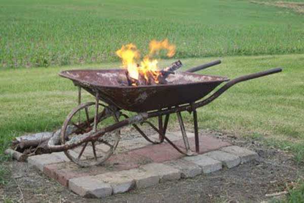 WHEEL BARROW USED AS A FIRE PIT