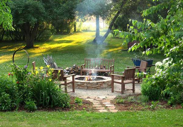 SERENE FIRE PIT AREA NESTLED IN AN OASIS OF VEGETATION