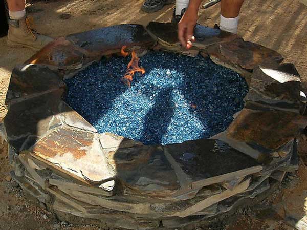 FIRE PIT DECORATED WITH BLUE GLASS