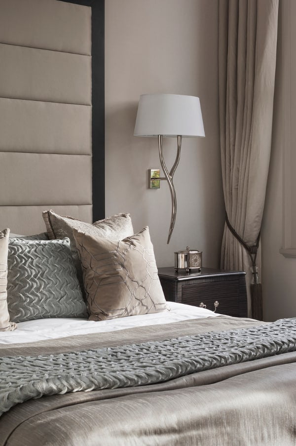 elegance aided by taupe colors in a luxurious bedroom design