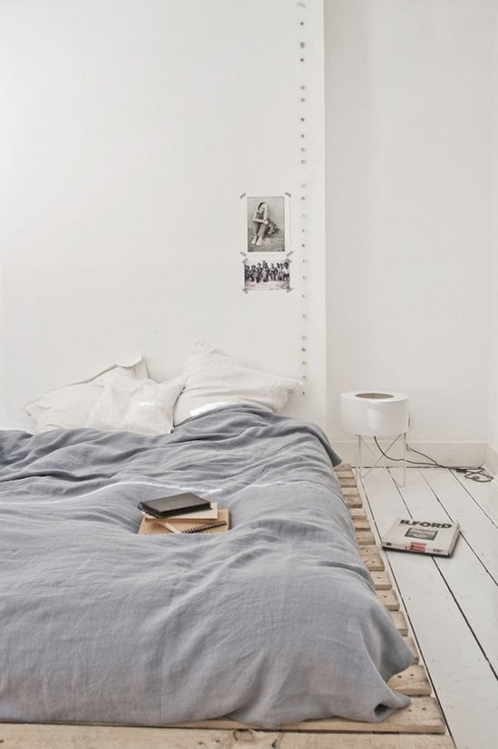 15. A VERY LOW PALLET BED FRAME OFFERING COMFORT IN A MINIMAL DESIGN