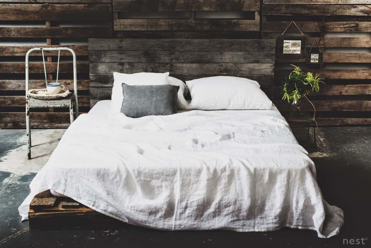 COZY DARK HUED BED FRAME IN A SIMILAR BACKGROUND DESIGN