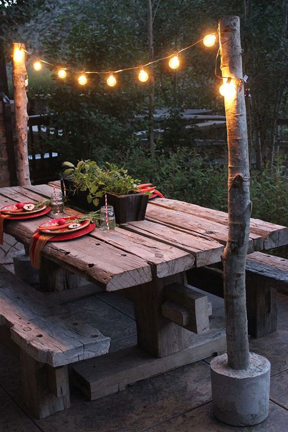 unique string light across a beautiful rustic bench