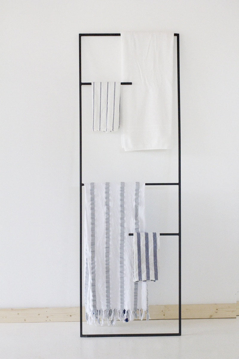 11. the simplest most geometric metallic ladder can serve as a towel holder