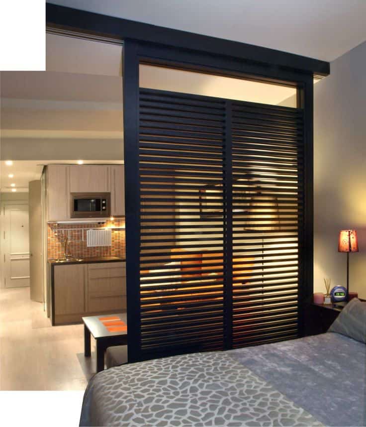 23. add a sliding wooden privacy screen to separate the bedroom