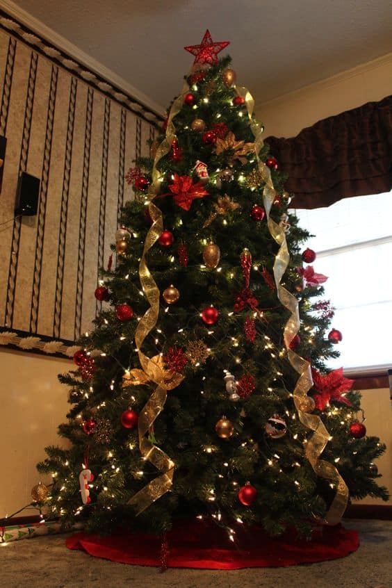 Cascading golden ribbon and shiny red decors