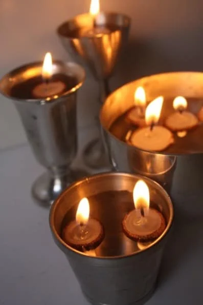 25. USE ACORN CAPS TO FORM FLOATING CANDLES