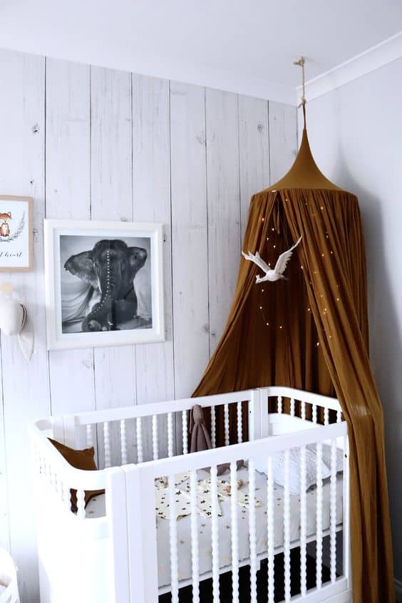 17. EARTHLY TONE AND FAIRY LIGHTS OVER CLASSIC CRIB