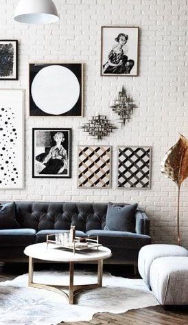 timeless white brick wall with black and white picture frames
