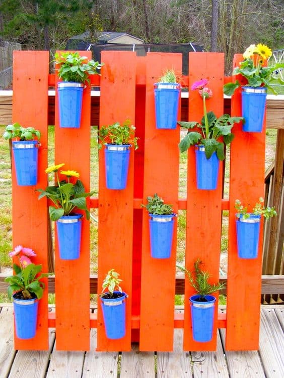 65. COLORED VERTICAL PALLET PLANTER WITH DOLLAR CUPS