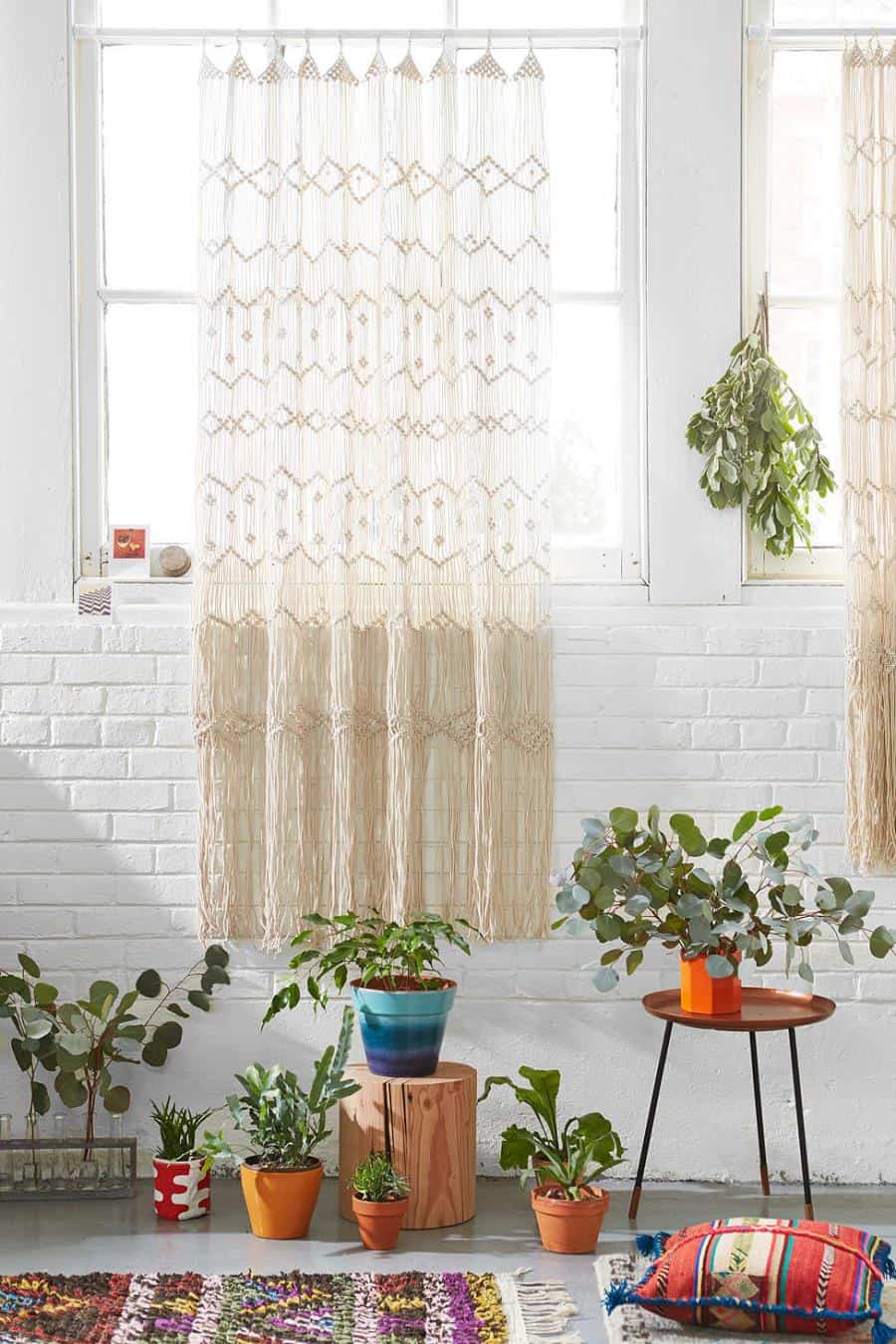 shabby chic white brick wall surrounded by plants and textiles
