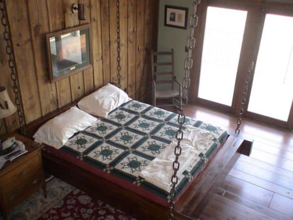 Timber-frame-hanging-bed-for-the-rustic-look