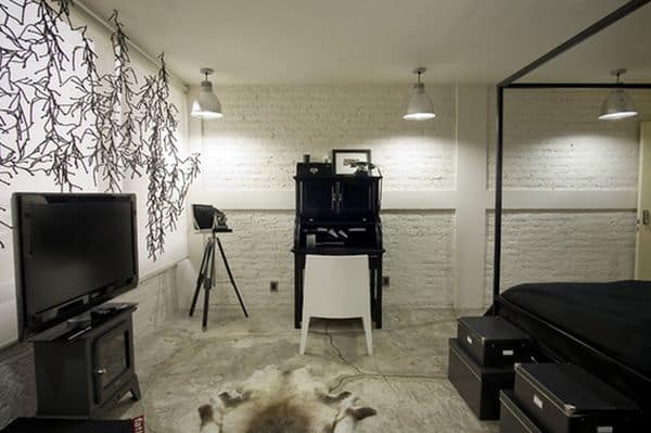 white brick wall in industrial bedroom