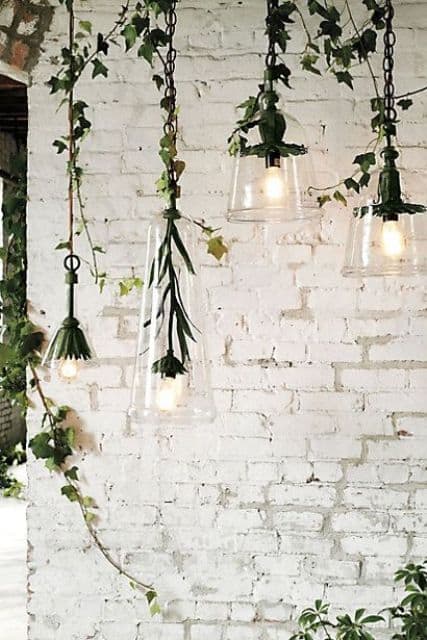 brick white wall with greenery and light