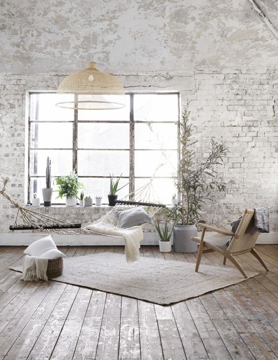 white wall and bricks exposed in a splendid bohemian decor