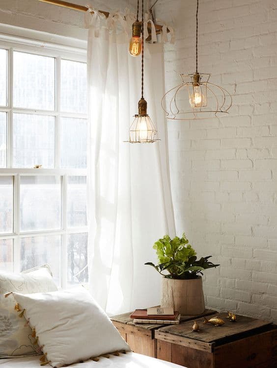 rustic industrial bedroom featuring white bricks