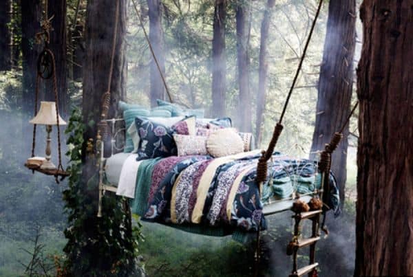 romantic hanging bed in thw woods