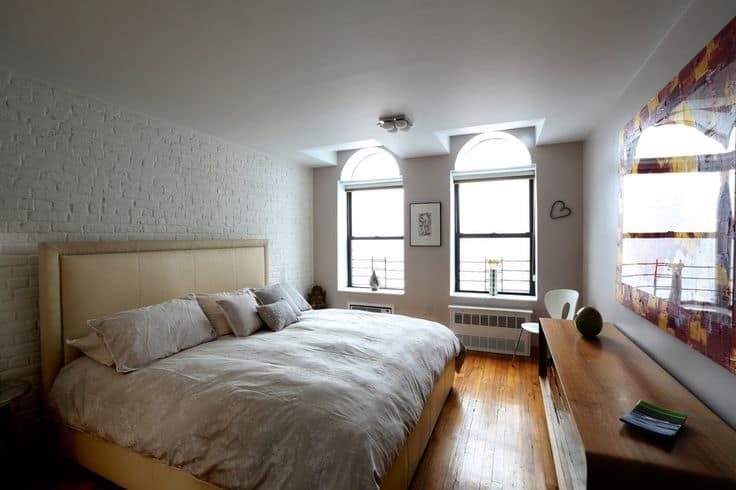 brick wall in white tailored in beige bedroom