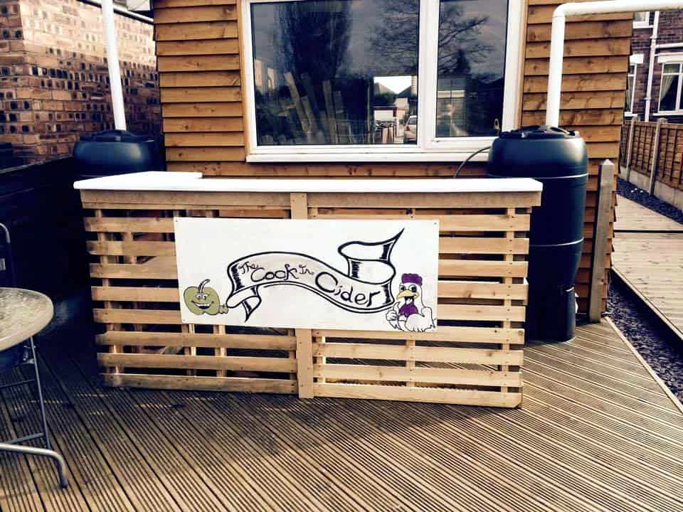 pallet bar with custom logo and white painted top