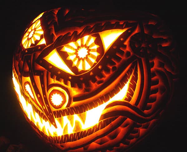 9. INTRICATE EVIL PUMPKIN CARVING SMILING 