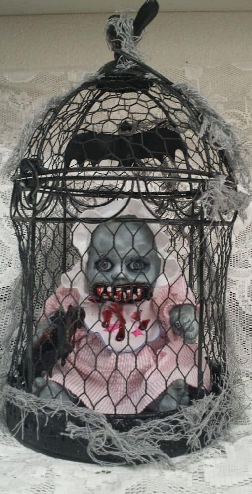90. THE CREEPY DOLL IN A CAGE