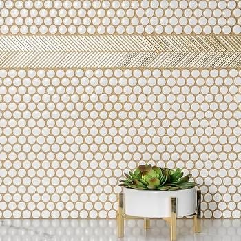 pennies on the tile look accentuated with the addition of golden grout