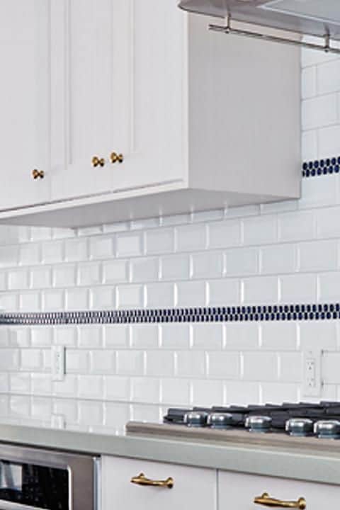 use these tiles as accents on your backsplash at regular interval
