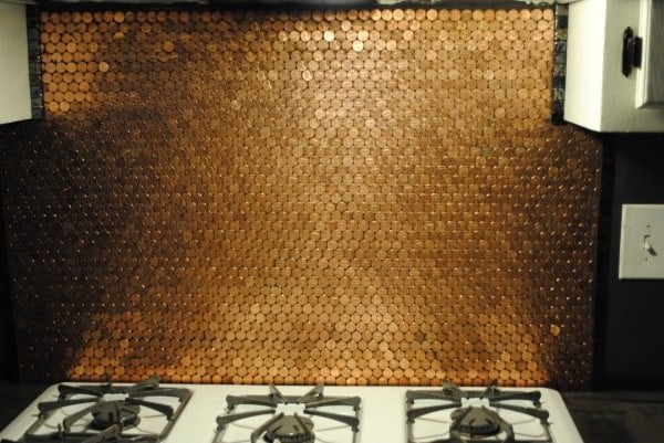 penny backsplash will give a rustic metallic look to your kitchen