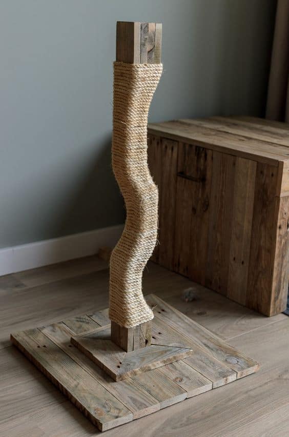22. WOOD AND YARN SCULPTURAL SCRATCHING POST