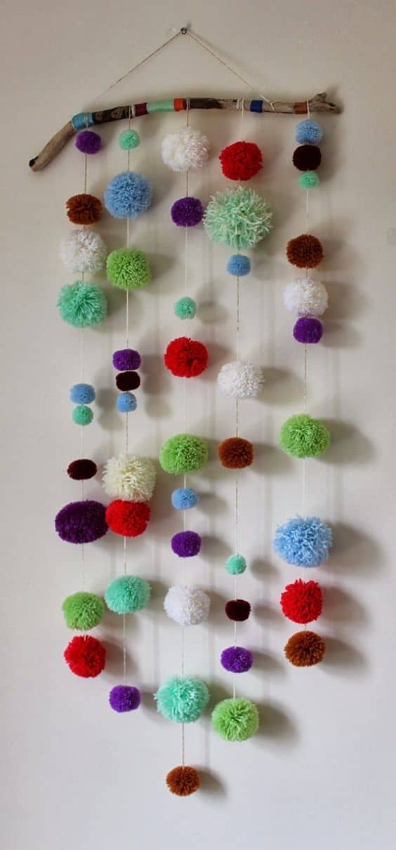 37. POM POM WALL HANGING DOUBLING AS CAT TOY