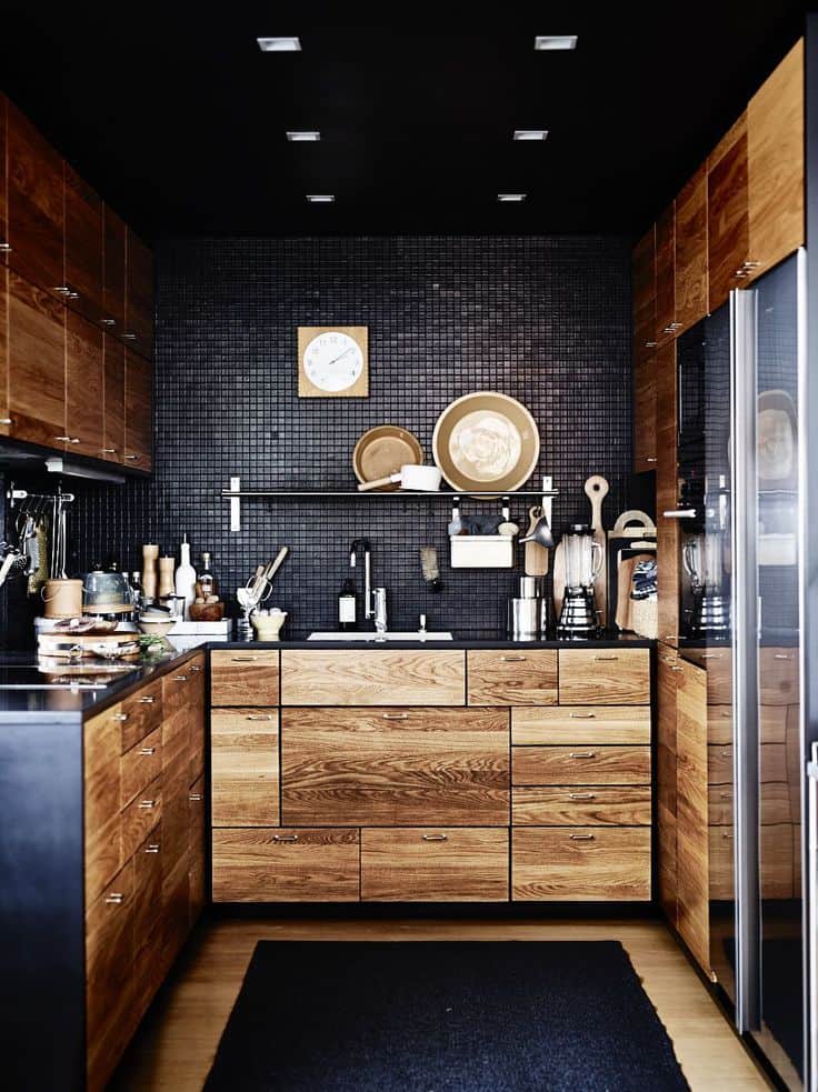 Black small tiles and wood cupboards