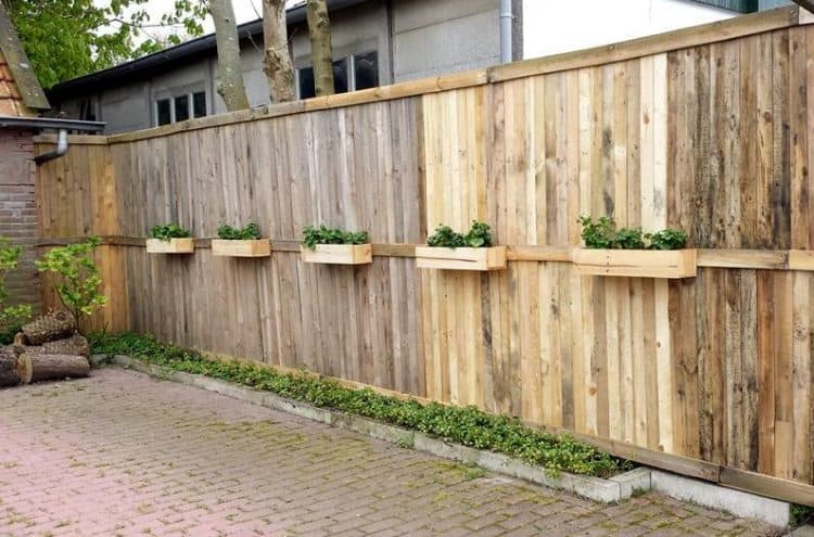 WOODEN FENCE WITH A SMALL PLANTING AREA