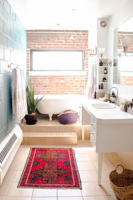 14 raw brick wall and a bathtub at it to make the bathroom more original