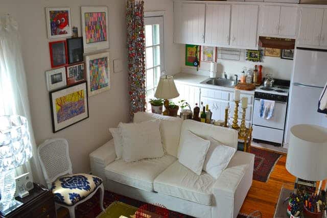 living room with small kitchenette in efficiency apartment